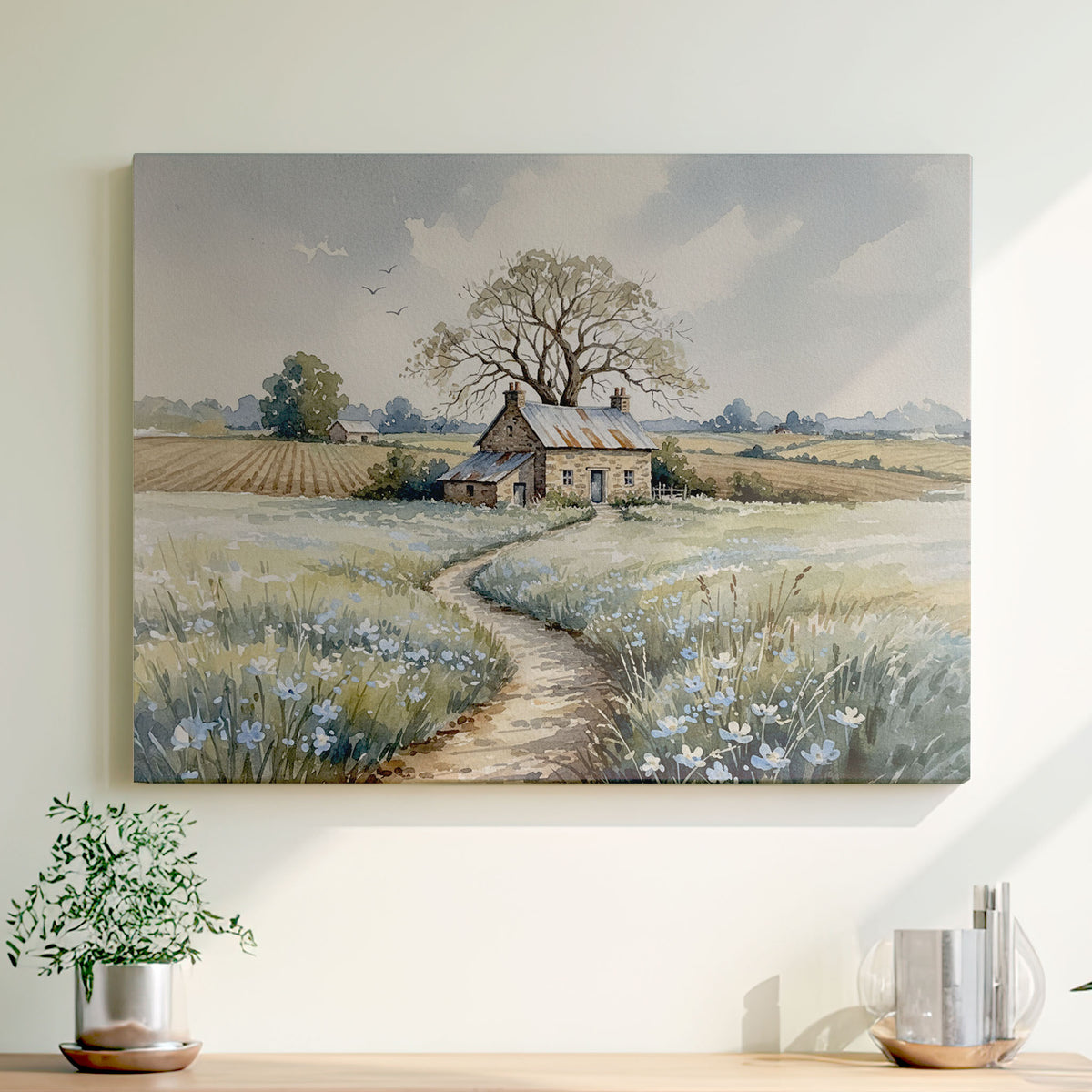 Soft watercolor of a stone cottage under a large tree with a winding path through blue and white wildflowers