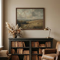 Sheep landscape print above a bookcase