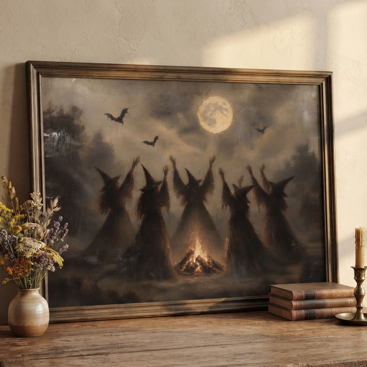 Dark painting of cloaked witches gathered around a bonfire under a full moon with flying bats
