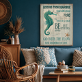 Teal seahorse art on a navy wall above a blue sofa