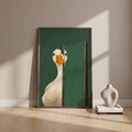 Goose print leaning on a floor beside a vase