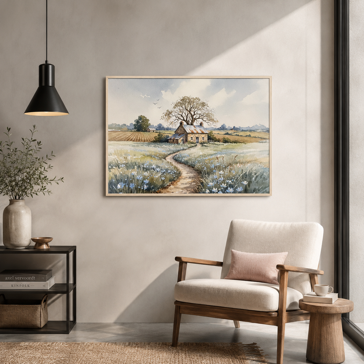 Stone cottage watercolor above a beige armchair