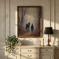 Witch and horse print above a cream cabinet with a black lamp
