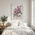 Roses on wood print above a white bed