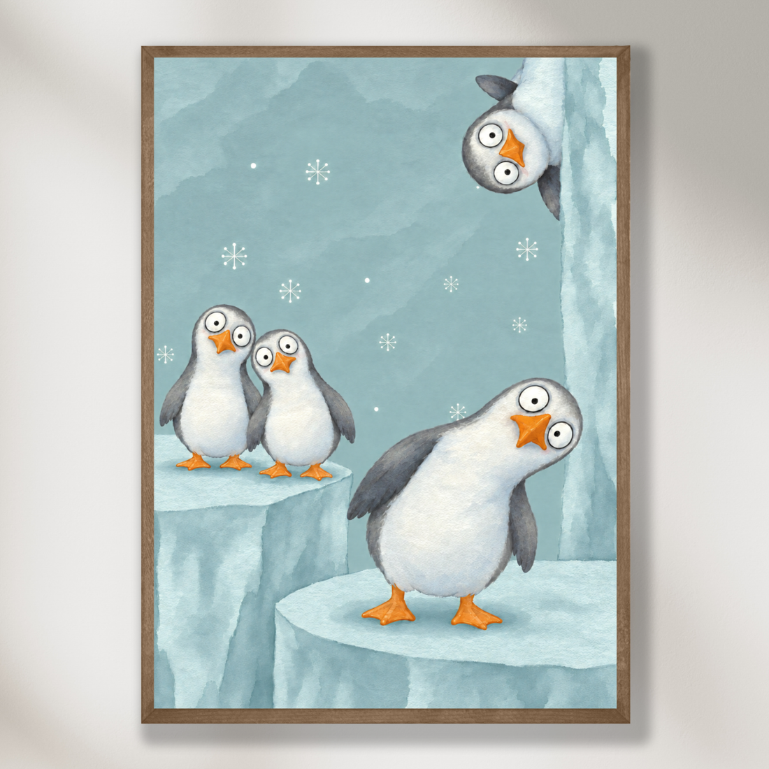 Cute winter nursery art of penguins standing on blue ice under falling snow, one looking at a hanging ornament