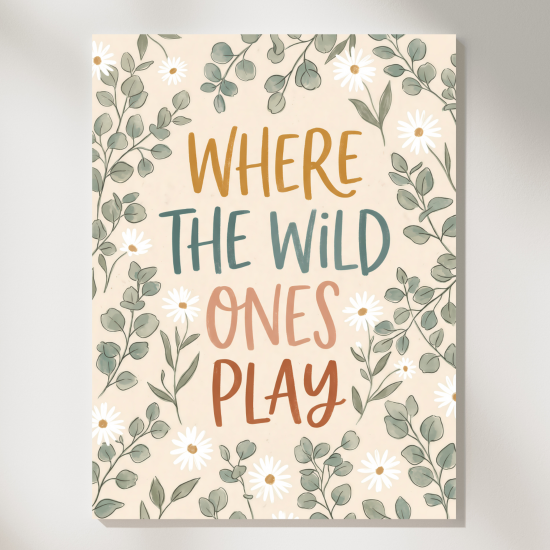 Botanical kids playroom print reading where the wild ones play surrounded by small leaves and flowers