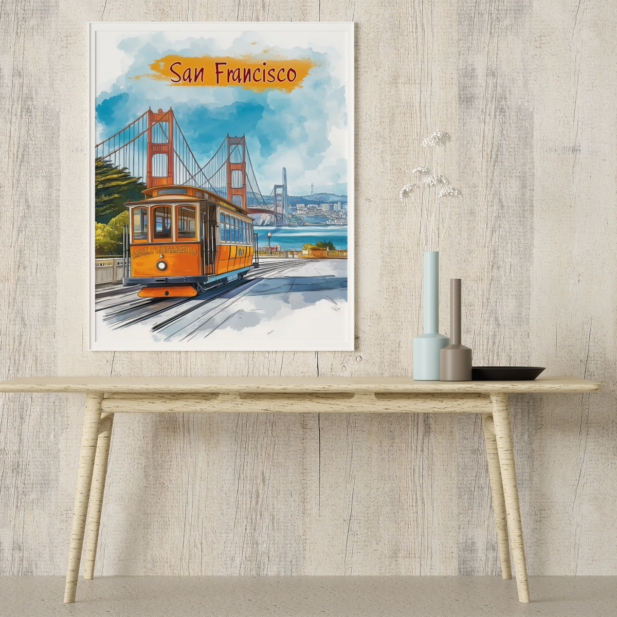 San Francisco cable car art print above a light wooden console table