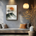 Mountain sunset print above a gray sofa